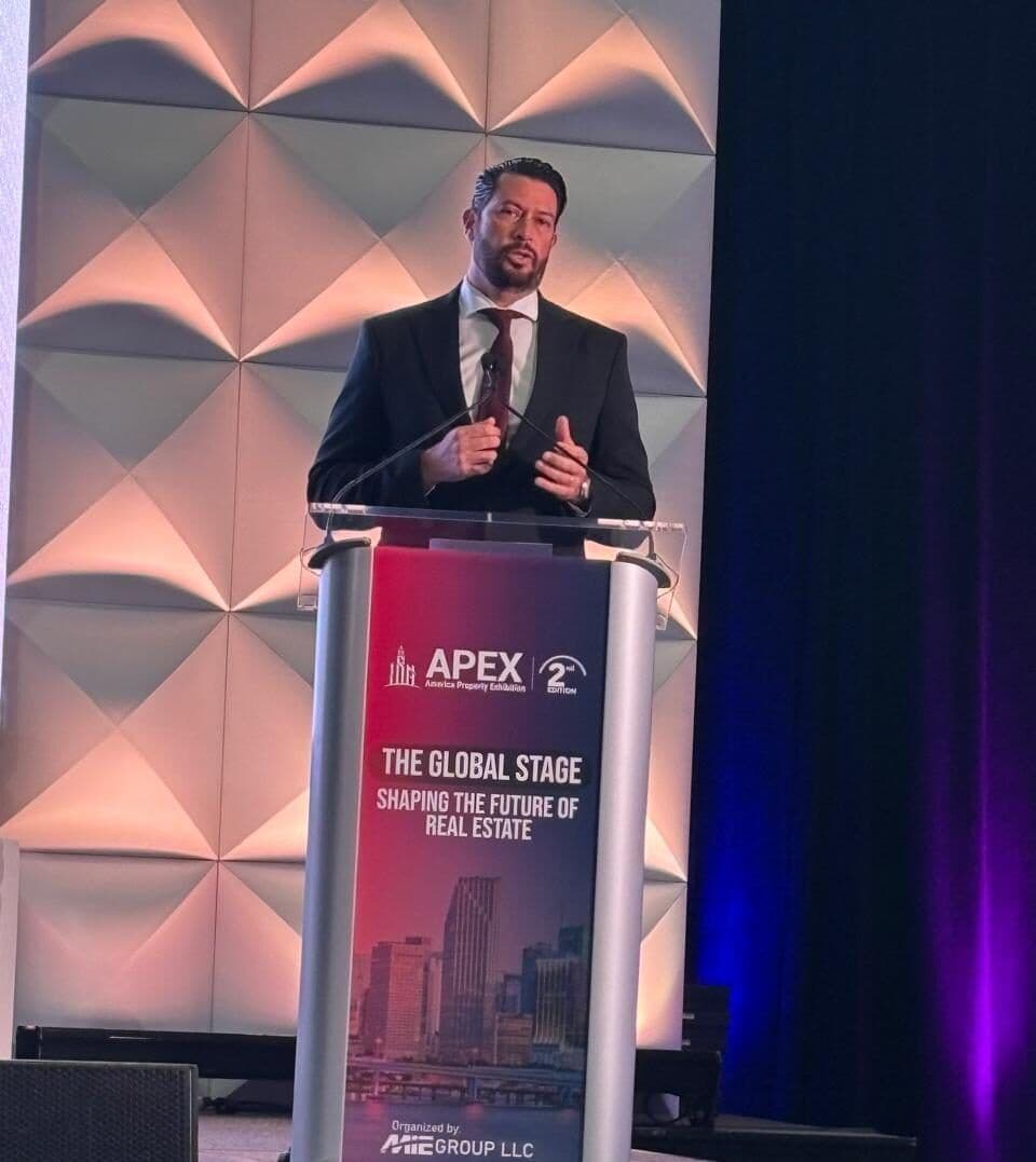 José Bolio Halloran speaking at the APEX 2025 podium, Miami Beach Convention Center